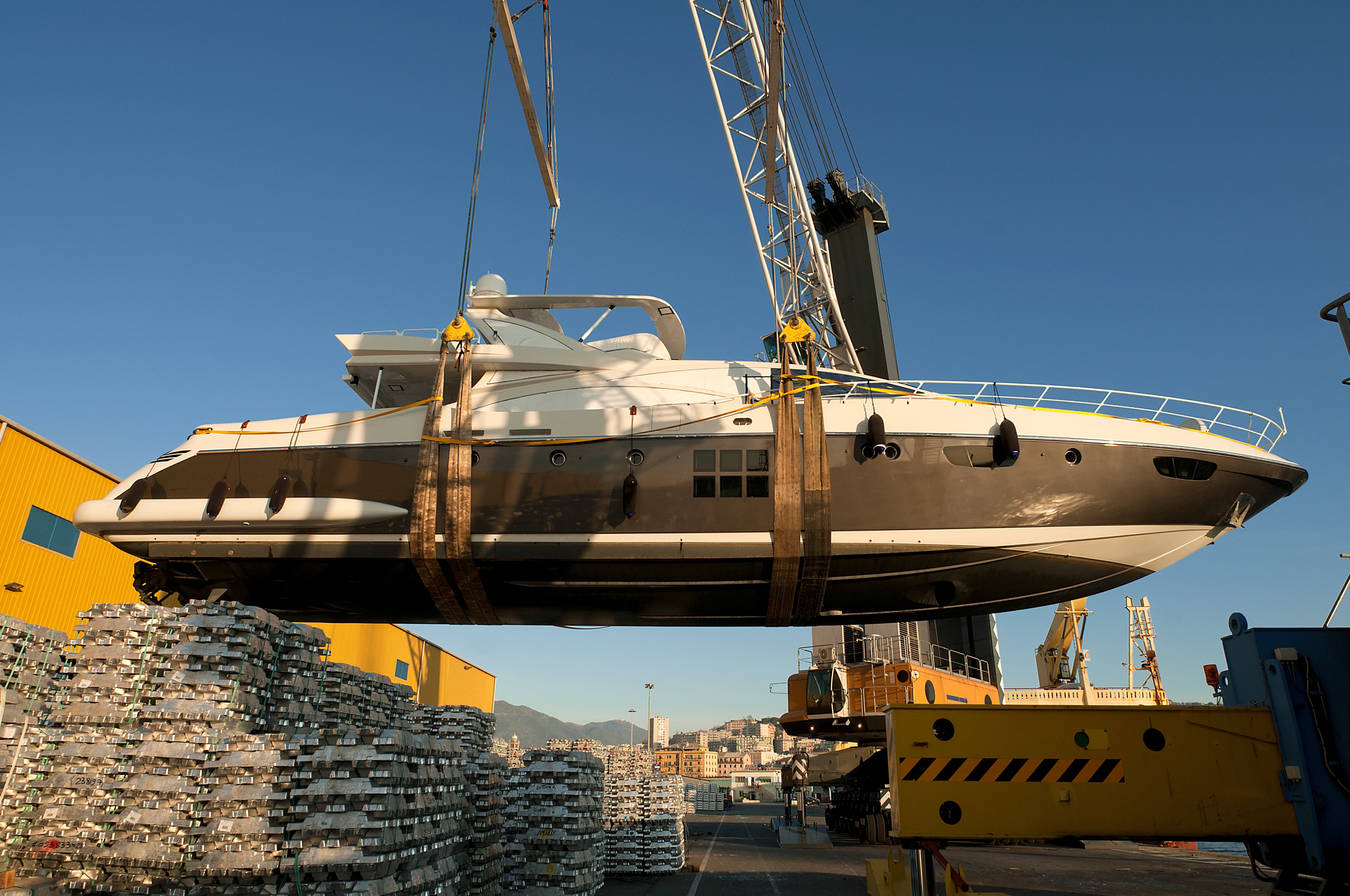 Picture of a boat being lifted by a crane