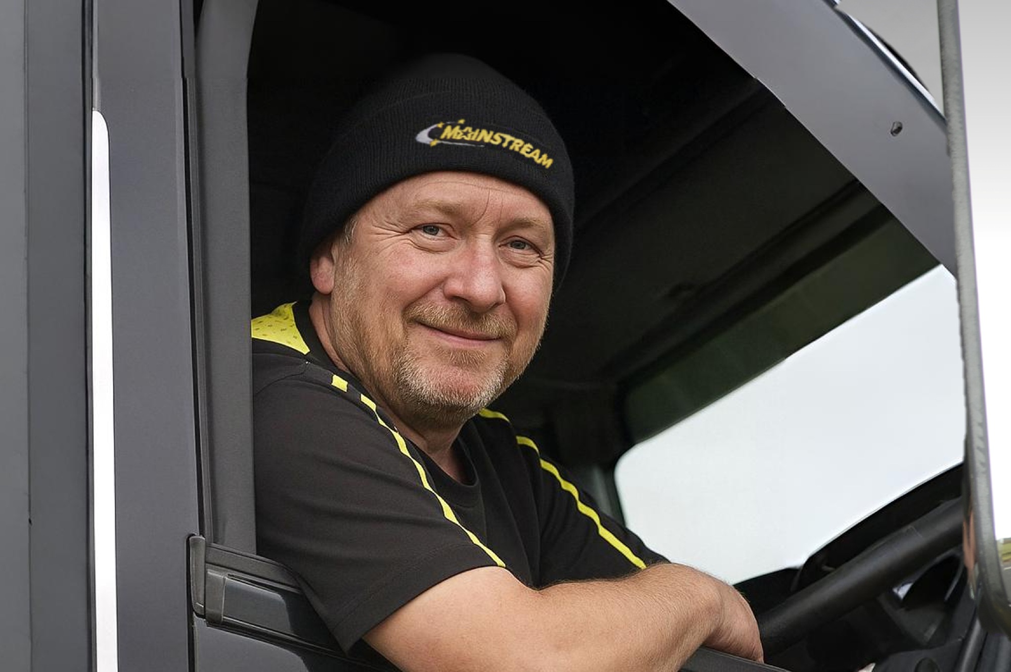 Image of a Mainstream staff member looking at camera while on a forklift