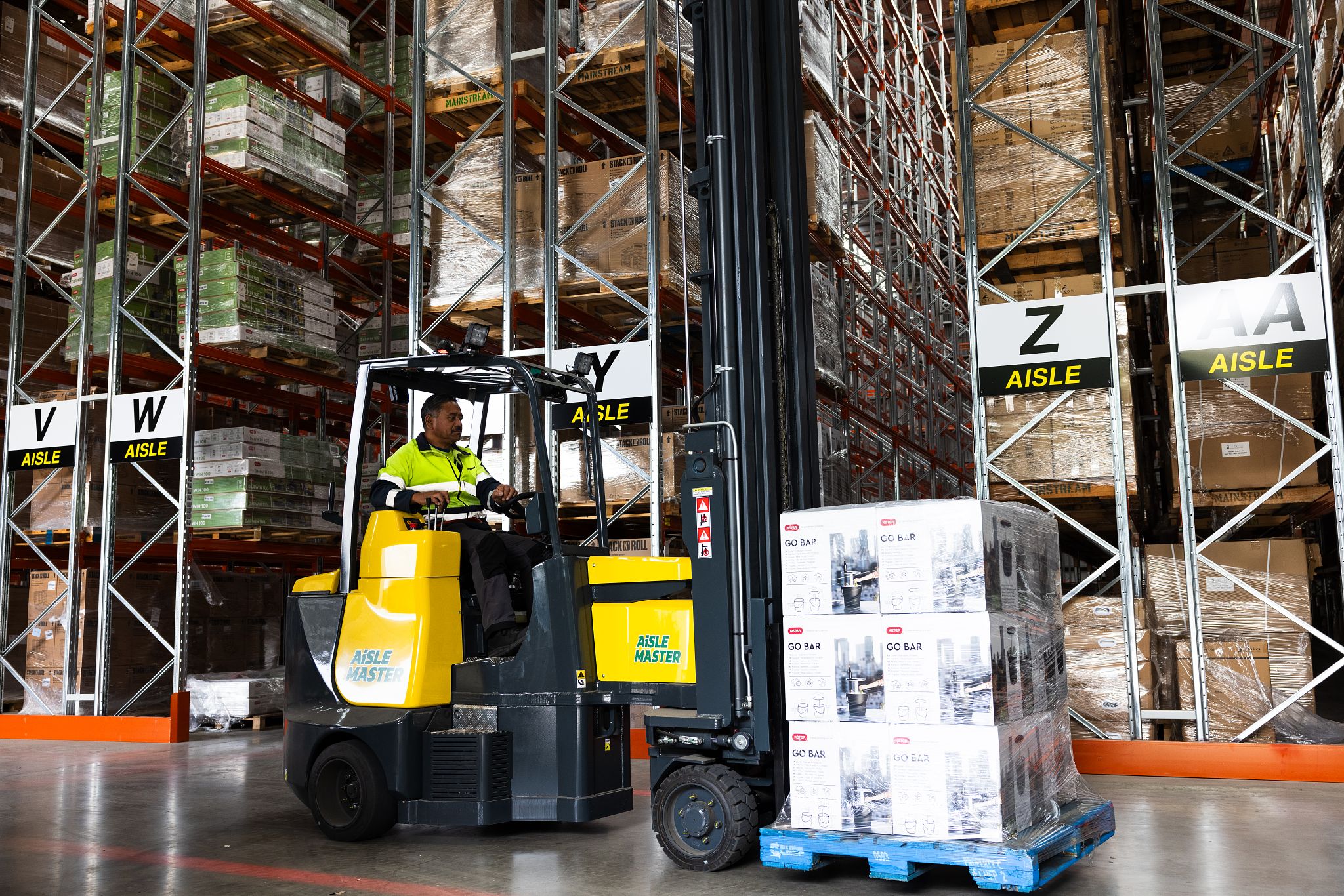 Image of a Mainstream Logistics Storeperson moving a pallet