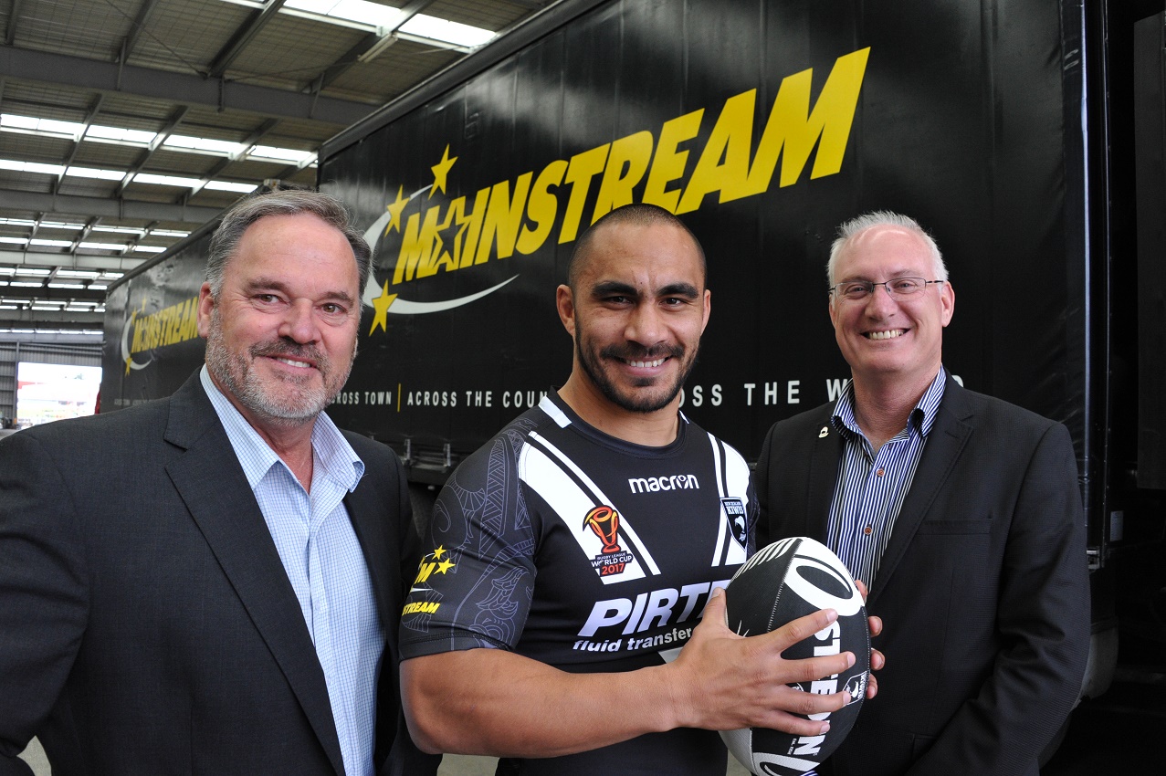Picture of three men in front of a Mainstream truck