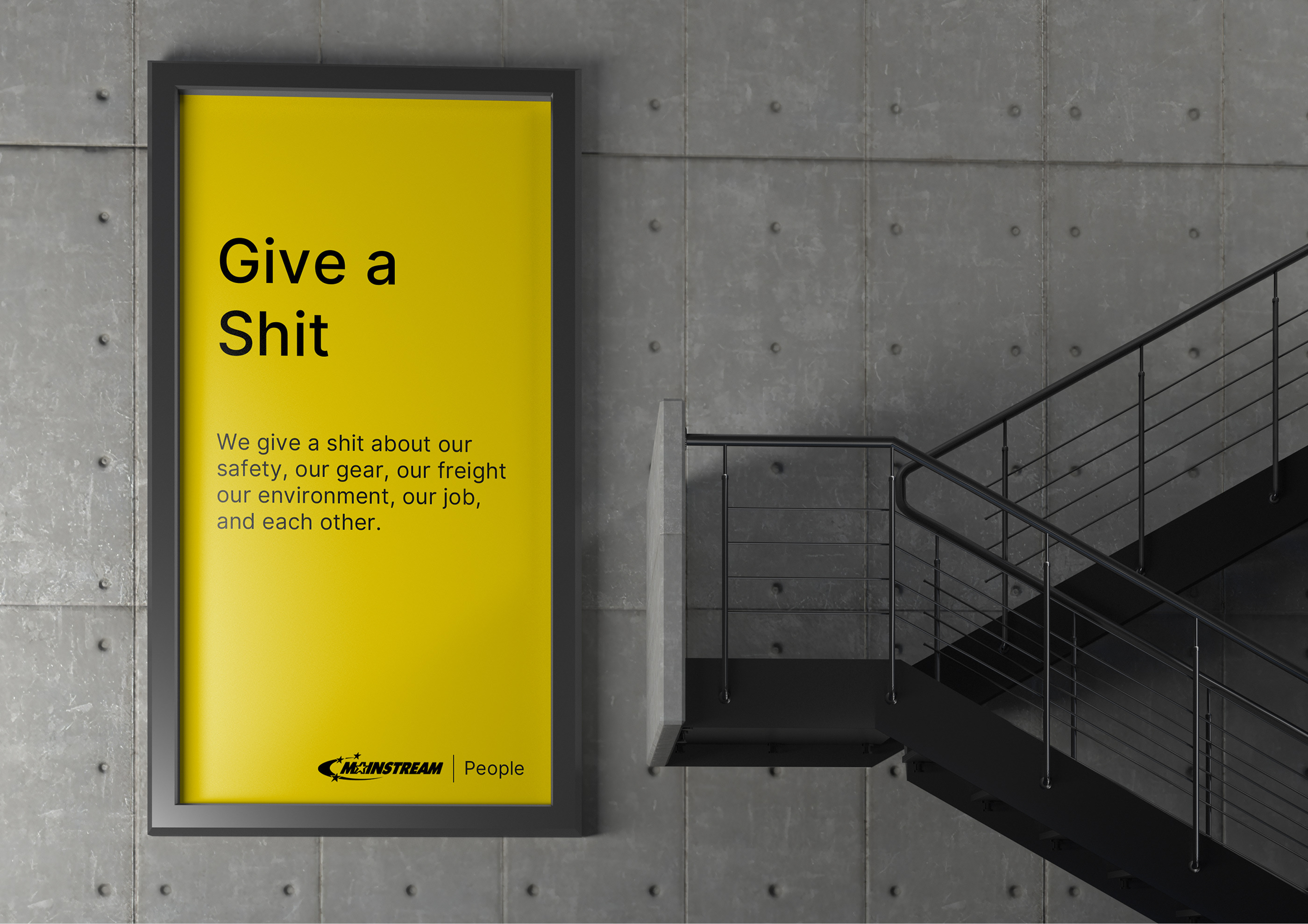 Picture of a Yellow Mainstream poster next to a staircase that says 'Give a shit'