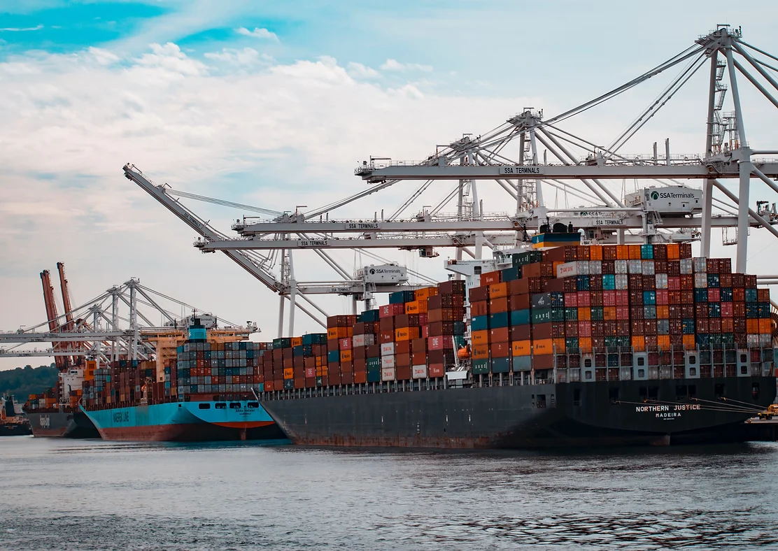 Picture of multiple container ships docked at a port